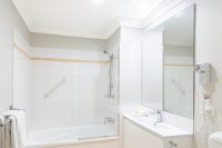 The Brighton 1 & 2 Bedroom Apartment Bathroom with Bath